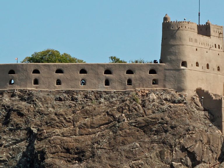 Al-Jalali Fort in Muscat, Oman, built in the 16th century, protected the city from invasions. Situated on a hill, it offers panoramic views and boasts two towers and a central courtyard.