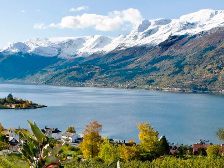 Hardangerfjord is a beautiful fjord located in western Norway. It is the second longest fjord in the country and one of the most popular tourist destinations in the country, known for its stunning natural beauty, abundant fruit orchards, and picturesque villages.