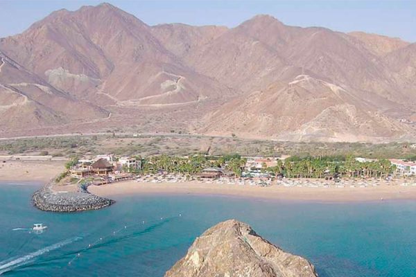 Khor Fakkan, near Dubai, offers stunning beaches, serene shorelines, and iconic landmarks like Sheikh Zayed Mosque and its fortress, captivating visitors.
