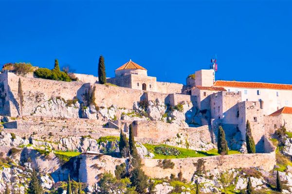 Perched on a hill, Klis Fortress offers captivating views of the Adriatic Sea and Split city. Immerse in Dalmatian history, witness ancient architecture, and explore military exhibitions at this well-preserved medieval castle.