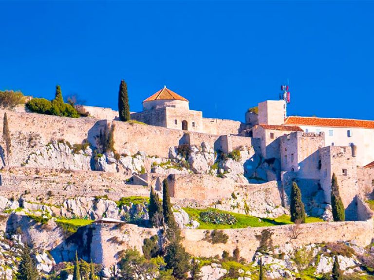Perched on a hill, Klis Fortress offers captivating views of the Adriatic Sea and Split city. Immerse in Dalmatian history, witness ancient architecture, and explore military exhibitions at this well-preserved medieval castle.