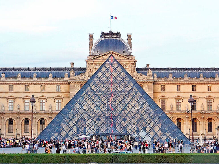 The Louvre Museum, a top Parisian attraction, houses iconic artworks like the Mona Lisa and Venus de Milo. Visitors can immerse themselves in a vast collection of art, sculpture, and historical artifacts.