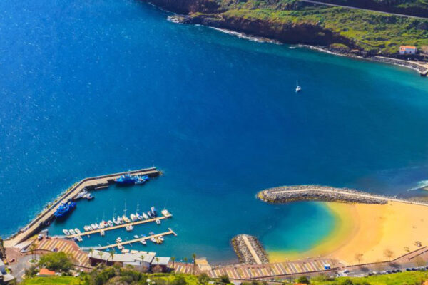 Machico Bay, nestled in Madeira Archipelago, holds a historic connection with fishing and settlers. The bay's scenic beauty, complemented by the Desertas Islands and Ponta de São Lourenço views, entices tourists for serene beach getaways, particularly in the summer.