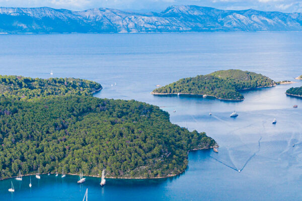 Mljet National Park is a beautiful park covering the majority of the northwest part of Mljet Island in Croatia. This area is characterized by dense Mediterranean vegetation, two large salt lakes connected by a narrow channel, and a 12th century Benedictine monastery.