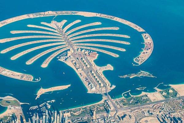 Palm Jumeirah, Dubai's iconic artificial island, boasts luxury resorts, residences, beaches, shops, restaurants, and a connecting monorail system.
