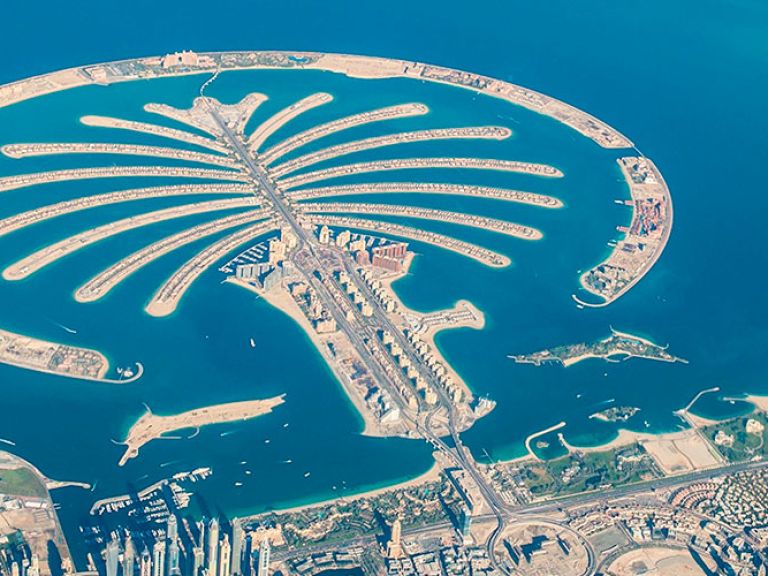Palm Jumeirah, Dubai's iconic artificial island, boasts luxury resorts, residences, beaches, shops, restaurants, and a connecting monorail system.