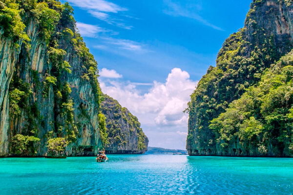 Discover Pileh Lagoon on Koh Phi Phi Leh island, Thailand. This crystal-clear pool offers a paradise for snorkeling and bathing, embraced by limestone cliffs. Dive into its unique beauty and encounter diverse marine life, creating an unforgettable aquatic adventure.