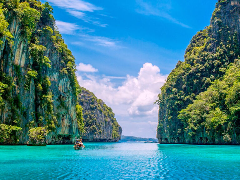 Discover Pileh Lagoon on Koh Phi Phi Leh island, Thailand. This crystal-clear pool offers a paradise for snorkeling and bathing, embraced by limestone cliffs. Dive into its unique beauty and encounter diverse marine life, creating an unforgettable aquatic adventure.