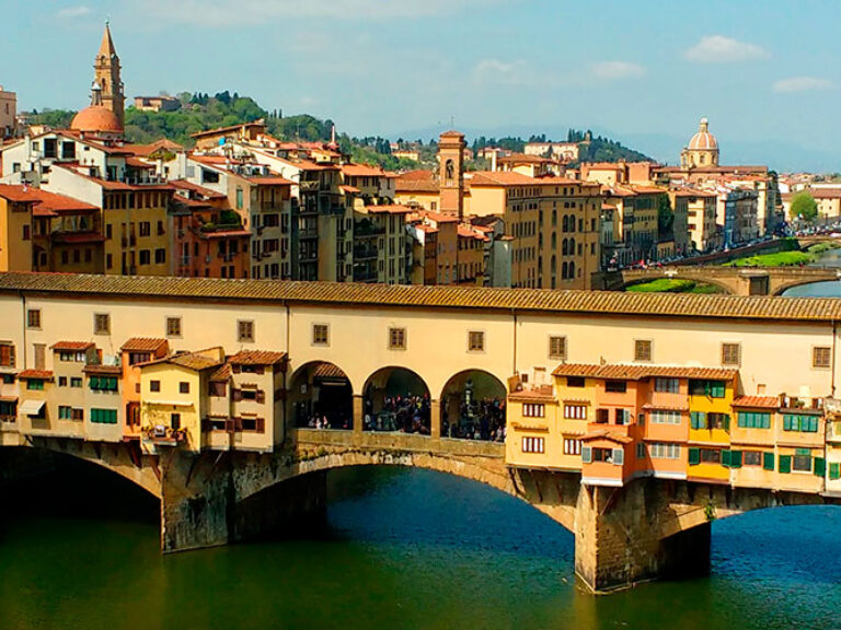 Ponte Vecchio (Old Bridge) is a medieval arched bridge over the River Arno in Florence, Italy, famous for having a number of shops (mostly gold and jewelers) built along it. The bridge is one of the most famous tourist attractions in Florence. It spans the Arno at its narrowest point where it is believed that a ford was once located.