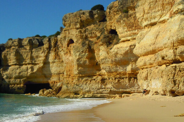 Praia da Coelha is a hidden gem tucked away along the Algarve coast in Portugal. This secluded beach enchants visitors with its pristine golden sands, crystal-clear waters, and dramatic cliffs. Relax under the sun, take refreshing dips, and immerse yourself in the peaceful ambiance of this idyllic coastal paradise.