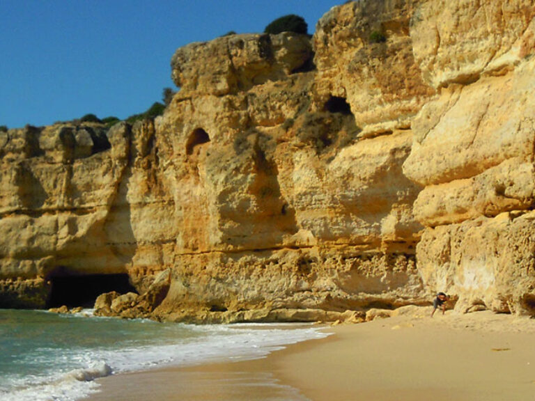 Praia da Coelha is a hidden gem tucked away along the Algarve coast in Portugal. This secluded beach enchants visitors with its pristine golden sands, crystal-clear waters, and dramatic cliffs. Relax under the sun, take refreshing dips, and immerse yourself in the peaceful ambiance of this idyllic coastal paradise.