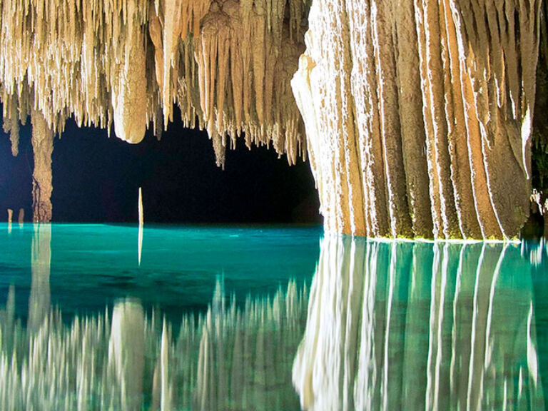 Rio Secreto in Quintana Roo, Mexico, is a striking underground river inside a nature reserve, teeming with stalactites, stalagmites, and diverse wildlife. This awe-inspiring locale, offering unforgettable guided tours, is a must-visit world wonder.