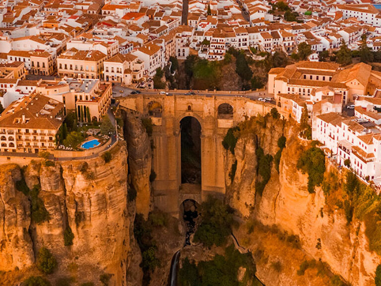 Ronda is a town in southern Spain that is known for its stunning views and rich history. Ronda is situated on a plateau in the Sierra de Ronda mountain range, about 750 meters above sea level.