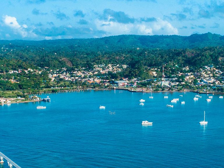 Samaná Bay in the Dominican Republic offers activities like kayaking and whale watching. The nearby beachfront town adds delicious dining and lively bars, making it an ideal Caribbean getaway.