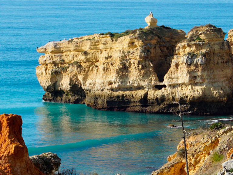 São Rafael Beach, nestled along the Algarve coastline in Portugal, is a breathtaking destination that captures the essence of natural beauty. With its golden sands, turquoise waters, and rugged cliffs, it offers a picturesque setting for sunbathing, swimming, and exploring hidden coves. A serene and captivating coastal retreat.