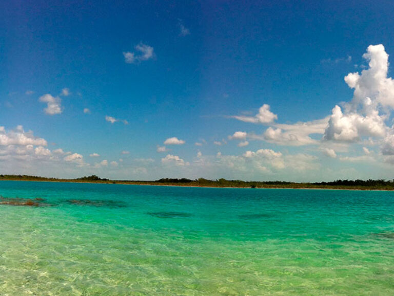 In Bacalar, Quintana Roo, lies the 'seven color lagoon' or Laguna de Bacalar. Its mesmerizing surface displays seven shades of blue, a result of minerals from an underground river feeding the lagoon.