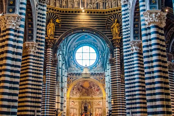 The Siena Cathedral is a famous church located in the city square of Siena, Italy. It is known for its Romanesque and Gothic architectural style.