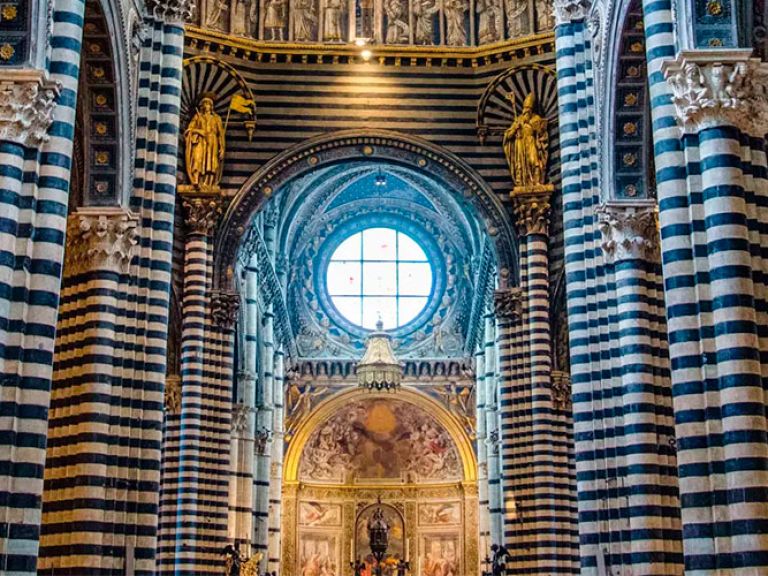 The Siena Cathedral is a famous church located in the city square of Siena, Italy. It is known for its Romanesque and Gothic architectural style.