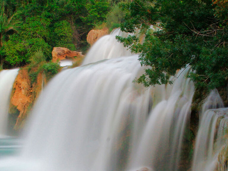Krka Waterfalls (Skradinski Buk) in Croatia, near Skradin, are the most famous and visited waterfalls of Krka National Park. The Krka River flows through a stunning karst landscape, creating lakes, canyons, and waterfalls.