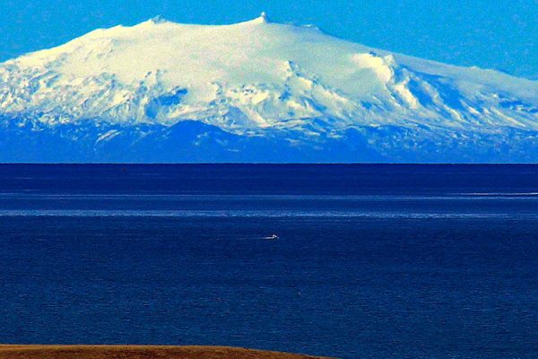 Snæfellsjökull is a volcano located on the Snæfellsnes Peninsula in West Iceland, and it is part of one of the country's three National Parks. The volcano is capped by a glacier and its summit stands at 1446 meters high.