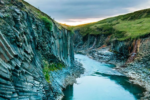 Discover the breathtaking beauty of Stuðlagil Canyon, an enchanting wonder tucked away in the rugged landscapes of Iceland. This comprehensive guide invites you to explore the mesmerizing allure of Stuðlagil Canyon, renowned for its vibrant basalt columns and crystal-clear glacial river.