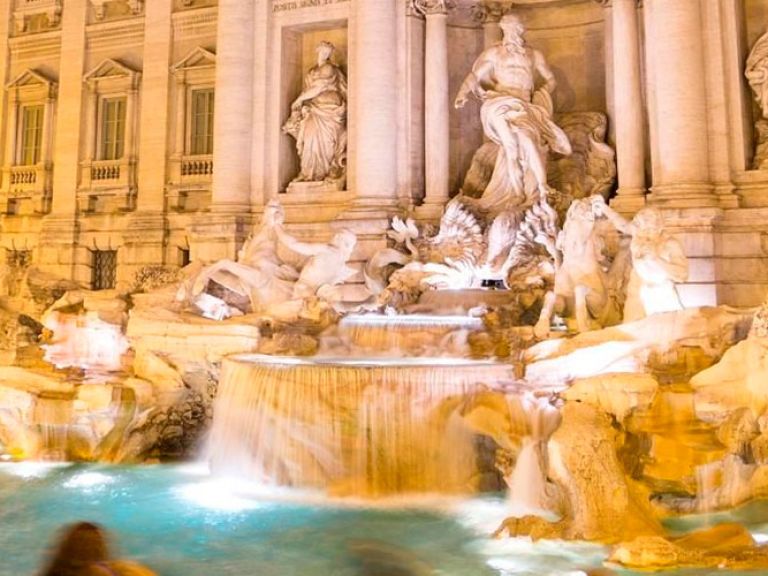 The Trevi Fountain in Rome, Italy, is a famous Baroque-style attraction designed by architect Nicola Salvi in 1762. Its charm and tradition of tossing coins for a wish make it a must-visit spot for tourists worldwide.
