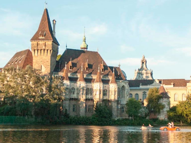Vajdahunyad Castle is a romantic castle located in Budapest, Hungary, in the City Park near the boating lake and skating rink. It is known for its eclectic architectural style and picturesque setting, making it a popular tourist destination.