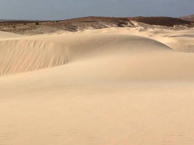 Viana Desert on Boa Vista Island, Cape Verde, boasts endless sand dunes, a top tourist draw. The golden sands and diverse dune heights provide panoramic vistas. Experience dune buggying, camel rides, and sandboarding for thrilling adventures.
