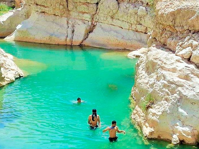 Wadi Ash Shab, in Oman's Al Sharqiyah region, boasts rugged mountains, clear waters, and diverse flora and fauna, making it a haven for nature enthusiasts.