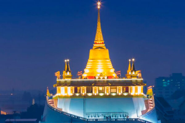 The Golden Mount Temple, or Wat Saket, in Bangkok, Thailand, is a popular tourist destination built on a man-made hill in 1832. Visitors can climb 306 steps to the top for panoramic views of Bangkok.