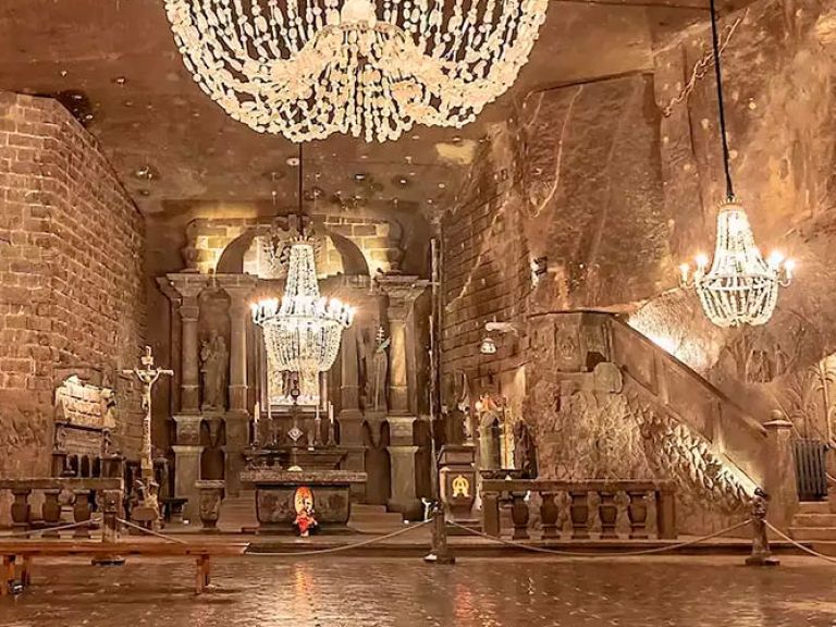Discover the Wieliczka Salt Mine, a UNESCO World Heritage Site in Krakow, Poland. With a 700-year history, explore the salt-carved Chapel of St. Kinga and other remarkable attractions like underground lakes, chapels, and statues. A captivating and one-of-a-kind destination to explore in Krakow.