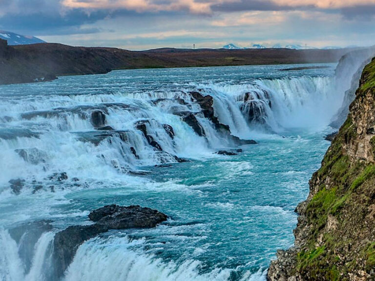 Located in the southwestern part of Iceland, Gullfoss Waterfall stands as a majestic testament to the country's awe-inspiring natural beauty. With its powerful cascades, breathtaking vistas, and rich history, Gullfoss captivates the hearts of visitors from around the world.