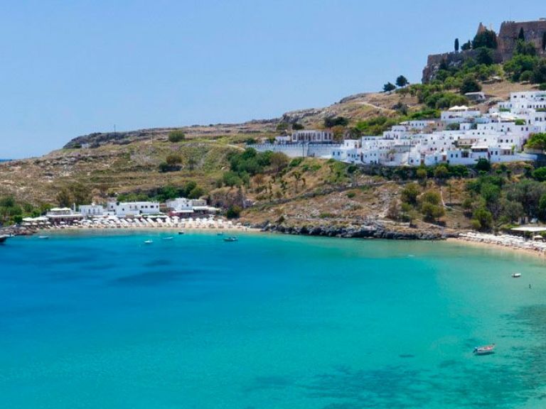 Lindos, located on Rhodes Island in Greece, is renowned for its pristine beaches, ancient ruins, and white-washed houses. Two popular beaches, Lindos Beach and tranquil St. Paul's Bay, are both within walking distance of the town.