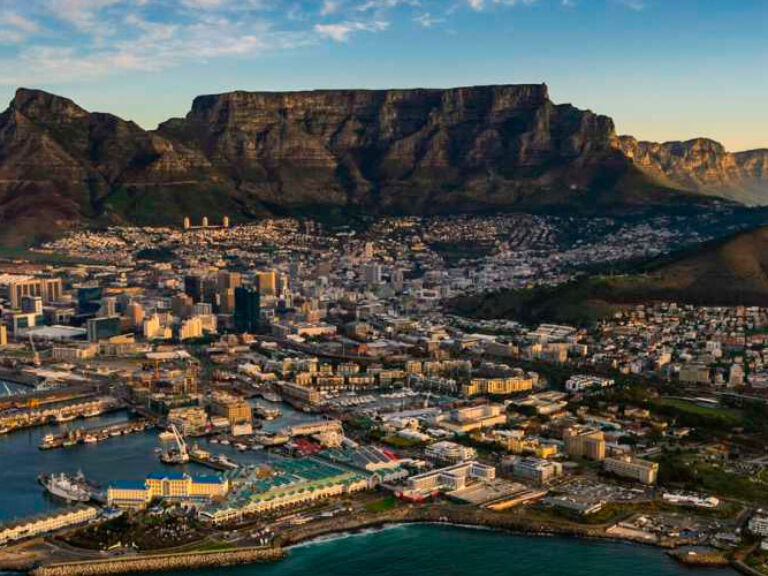 Table Mountain, a flat-topped peak in Cape Town, South Africa, boasts scenic views, trails, and a cable car, drawing tourists. Accessible routes include a cable car and Platteklip Gorge hike. It's one of the Seven Wonders of Nature.