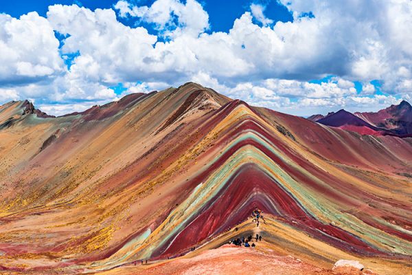 Rainbow Mountains, Cuzco, Peru: Peru, a captivating South American country, shares its vibrant culture and breathtaking landscapes with neighboring countries like Bolivia, Brazil, and Chile. It's a land of contrasts, from the Andean peaks to the Amazon rainforest, offering a rich blend of indigenous and Spanish influences. Peru is not just a destination; it's an experience waiting to unfold.