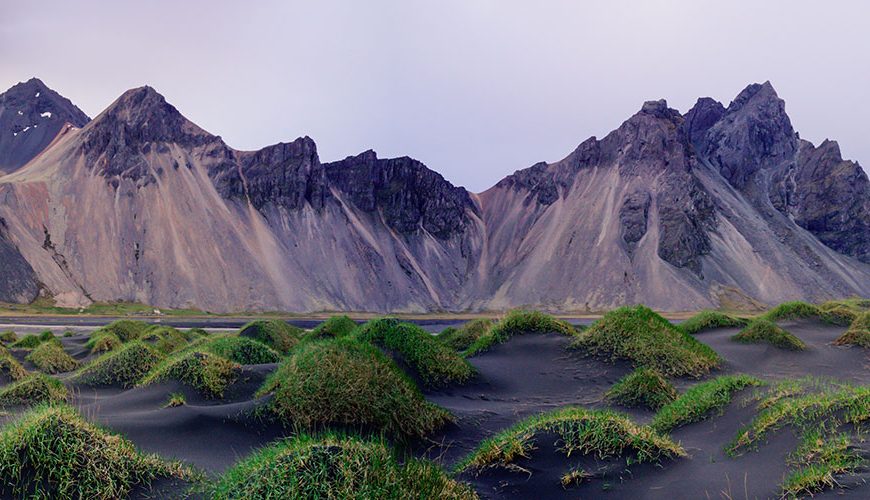 Sand dunes on the Stokksnes on southeastern Icelandic coast with Vestrahorn (Batman Mountain). Iceland, Europe