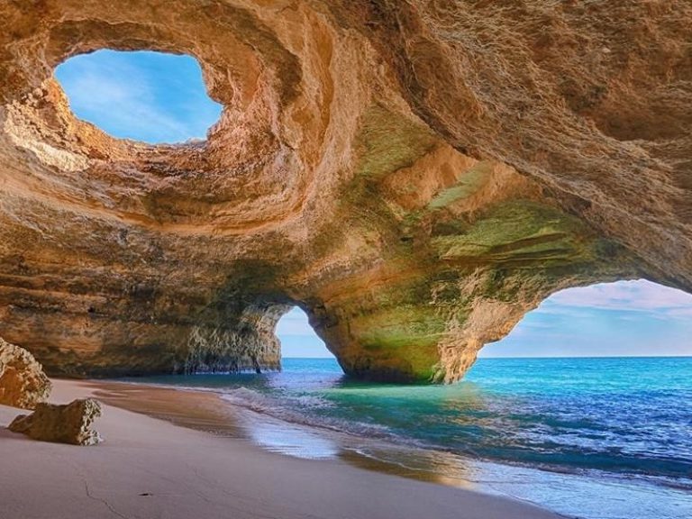 Discover Benagil Cave, a mesmerizing natural wonder along the Algarve coast in Portugal. Admire unique rock formations, bathe in turquoise waters, and witness the interplay of light and shadows. Experience its magic by guided boat tour or kayak, creating unforgettable memories in this enchanting sea cave.