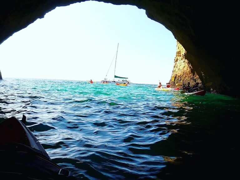 Benagil Kayak And Boat Tour From Portimão - On board a fantastic catamaran, contemplate the coast of the Algarve and then explore the caves and beaches of Benagil by kayak.