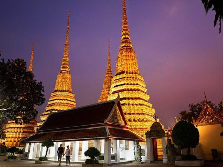 Bangkok Night Tour: Wat Arun, Wat Pho And Grand Palace – Small Group. Bangkok, the bustling capital of Thailand, comes alive at night. Whether you're a first-time visitor or a seasoned traveler, our evening tour offers a unique perspective of the city's iconic landmarks. Embark on a magical journey through the heart of Bangkok as the sun sets and the city's historic sites shine in a new light.