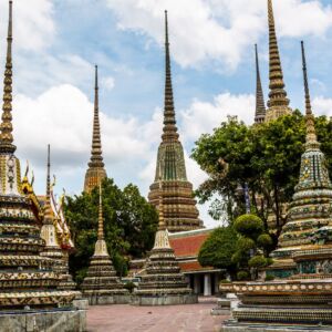 Wat Pho And Wat Arun Walking Tour with Professional Guide. Delve into the spiritual core of Bangkok by starting your journey at Wat Pho, home to the impressive 46-meter long reclining Buddha statue. As you wander through the temple grounds, let yourself be immersed in the rich history, intricate architecture, and centuries-old religious practices that this temple offers. No trip to Bangkok is complete without witnessing this giant depiction of the Buddha's enlightenment.