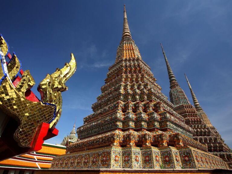 Wat Pho And Wat Arun Walking Tour with Professional Guide. Delve into the spiritual core of Bangkok by starting your journey at Wat Pho, home to the impressive 46-meter long reclining Buddha statue. As you wander through the temple grounds, let yourself be immersed in the rich history, intricate architecture, and centuries-old religious practices that this temple offers. No trip to Bangkok is complete without witnessing this giant depiction of the Buddha's enlightenment.