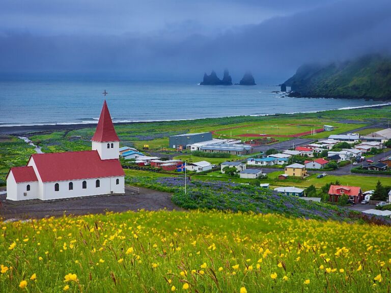 South Coast Classic (Guided In 10 Languages): Drive along the southwestern stretch of the ring road leading from Reykjavik along volcanoes, waterfalls, and glaciers to the black sand beach and Iceland's southernmost town, Vík. The tour starts with a drive through the Hellisheiði mountain pass bringing you through moss-covered lava fields and past geothermal springs down to farmland along the coastline.