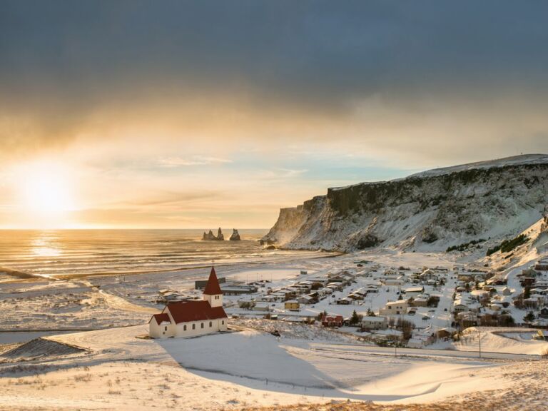 South Coast Classic (Guided In 10 Languages): Drive along the southwestern stretch of the ring road leading from Reykjavik along volcanoes, waterfalls, and glaciers to the black sand beach and Iceland's southernmost town, Vík. The tour starts with a drive through the Hellisheiði mountain pass bringing you through moss-covered lava fields and past geothermal springs down to farmland along the coastline.