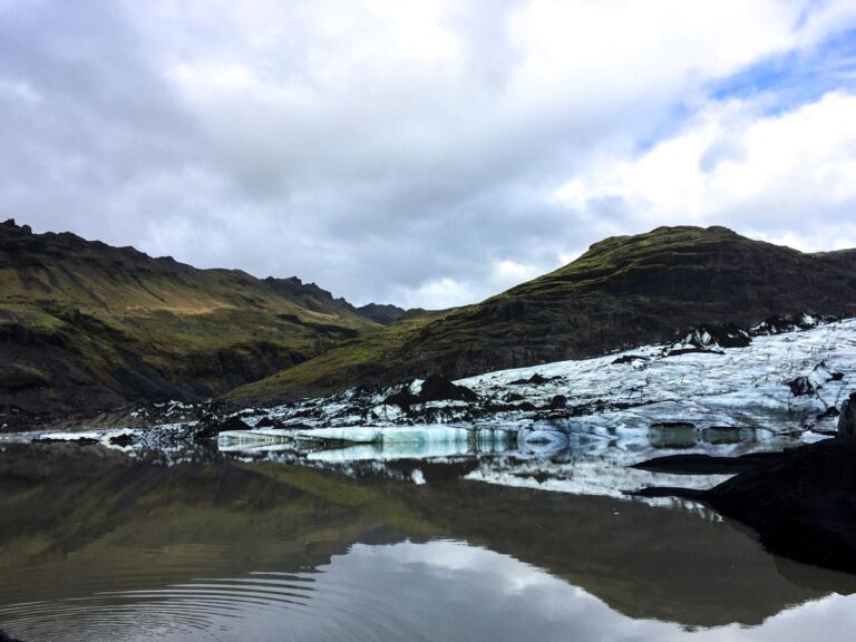 South Coast Classic (Guided In 10 Languages): Drive along the southwestern stretch of the ring road leading from Reykjavik along volcanoes, waterfalls, and glaciers to the black sand beach and Iceland's southernmost town, Vík. The tour starts with a drive through the Hellisheiði mountain pass bringing you through moss-covered lava fields and past geothermal springs down to farmland along the coastline.