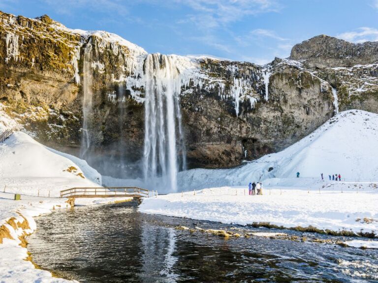 South Coast Classic (Guided In 10 Languages): Drive along the southwestern stretch of the ring road leading from Reykjavik along volcanoes, waterfalls, and glaciers to the black sand beach and Iceland's southernmost town, Vík. The tour starts with a drive through the Hellisheiði mountain pass bringing you through moss-covered lava fields and past geothermal springs down to farmland along the coastline.