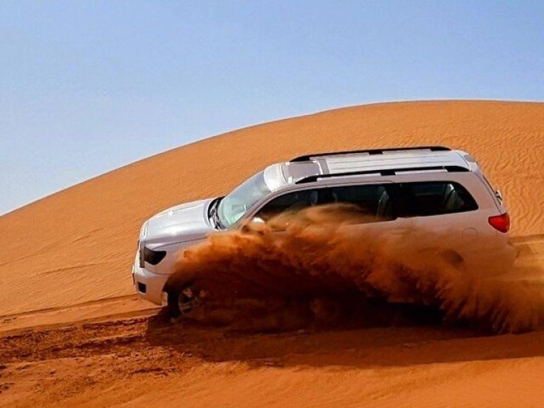 The Ghost Village Safari Tour with Dune Bashing and Sand-boarding.