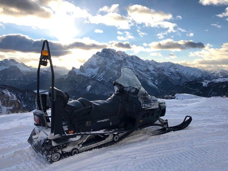 Dolomites Day Trip with snowmobile experience.