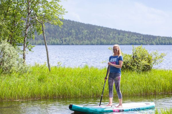 Arctic summer SUP boarding on a lake and river