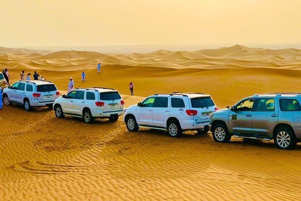 Afternoon Desert Safari with Quad Bike, Camel Ride and Sand-boarding