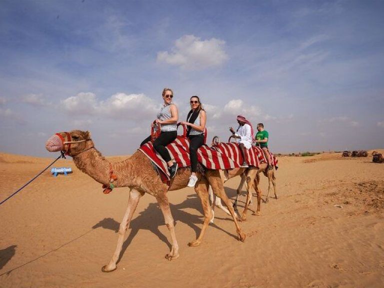 Desert Safari Tour with Camel Ride, BBQ Dinner, Sand Boarding & Live Shows.